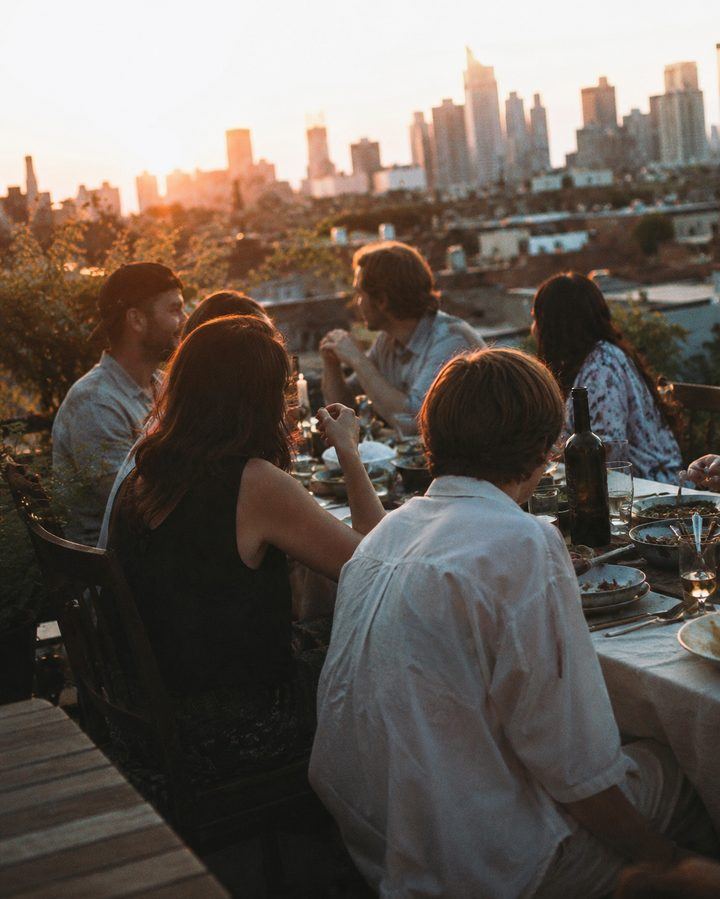 A group of friends together at golden hour