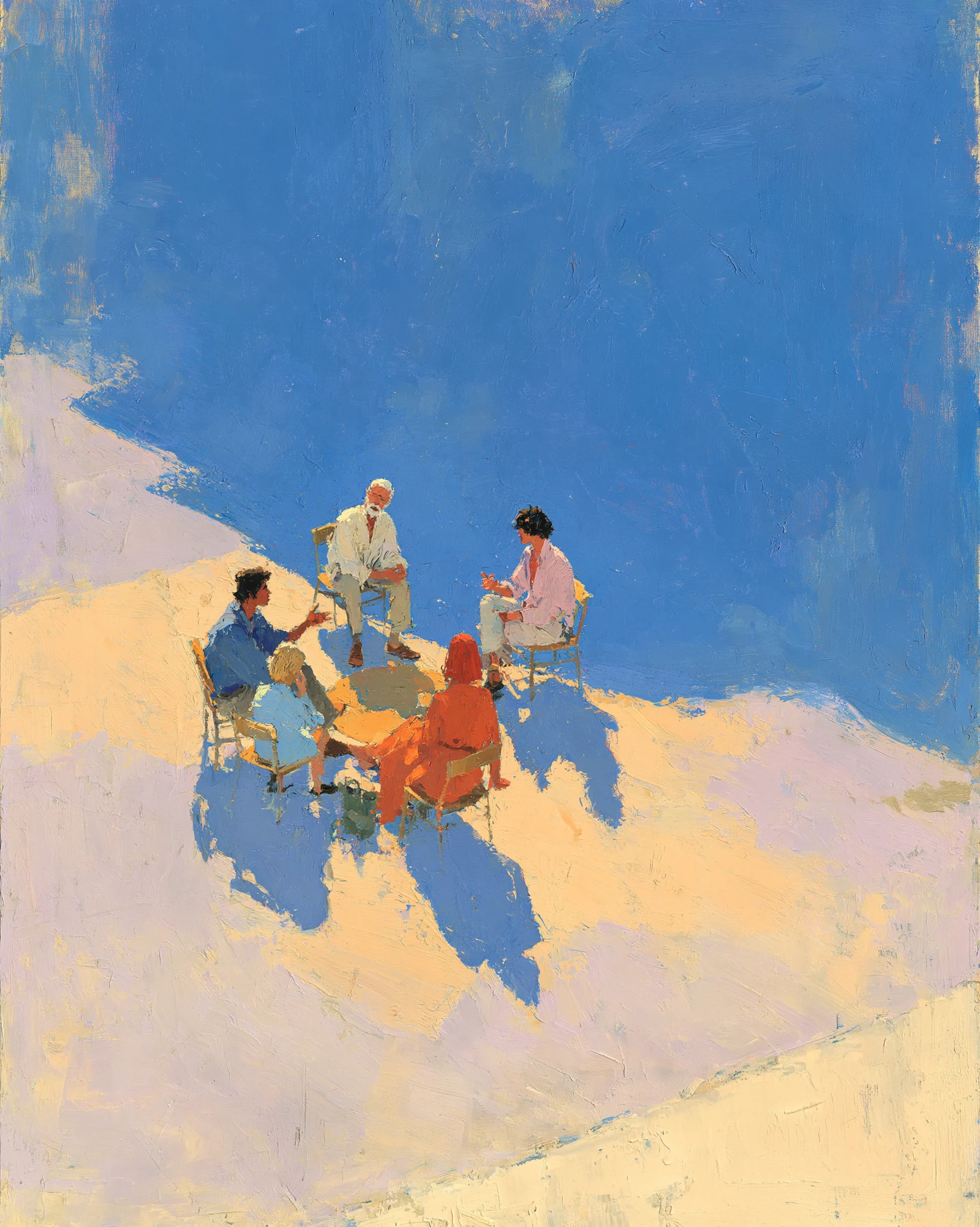 Four people sitting around a table in conversation under a vast blue sky — a team sharing honest feedback